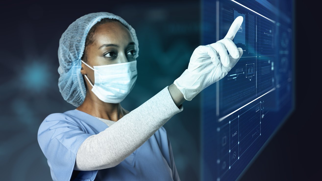 Insights - Human Factors Blog Part 2 Doctor touching modern virtual screen interface.